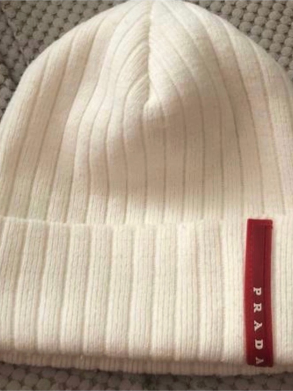 PRADA White Ribbed Knit Beanie with Red Logo Tab